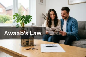 Awaab's Law: a Manchester couple reviewing property documentation alongside house keys, a model home and a printed agreement on a wooden table.